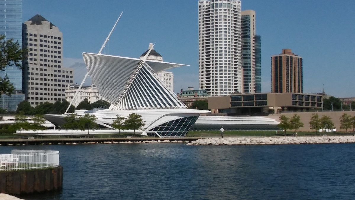 Diverse Milwaukee business professionals across multiple industries with digital marketing analytics overlays